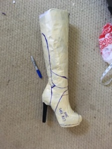 The "finished" taped-up boot (before I fixed the undersized calf piece). Ignore the misplaced line on the bottom of the ankle piece; that was for measuring purposes only.
